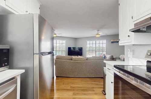 Surf Side Shores Condo | Upstairs duplex near the beach with deck, outdoor shower, W/D, streaming, & AC