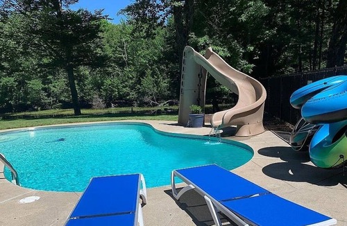 Menominee House | Well-appointed River home w/pool, screened porch, freestanding tub