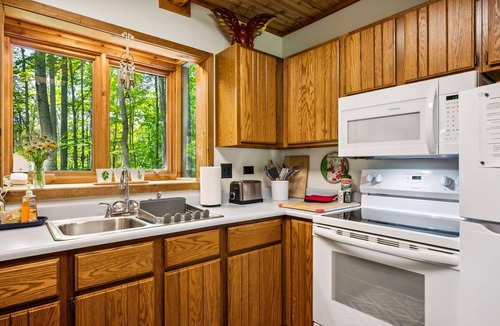 Gills Rock Cottage | Wooded cottage w/large screened porch & fire pit. Comfort and Nature combined.