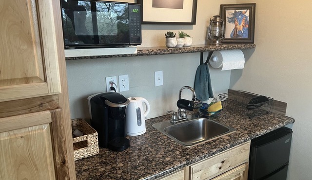 A cute and functional space located on beautiful 2.5 acres