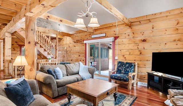 Dog-friendly cabin on expansive land with a firepit, grill, game room, & W/D