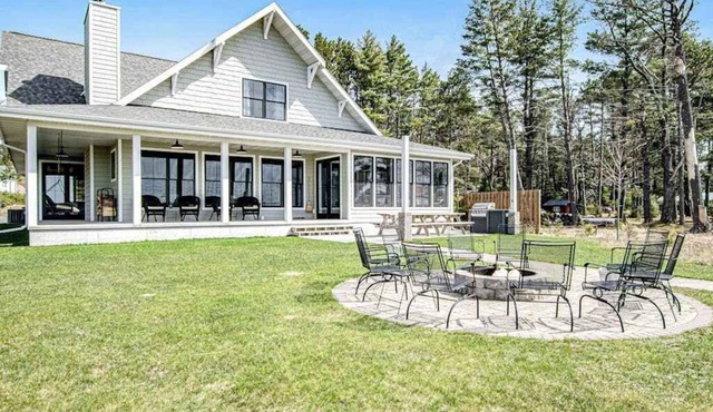 Dog-friendly, lakefront house with beach access, dock, AC, W/D, patio, & firepit