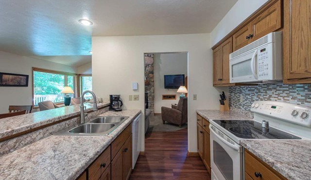 Elegant 2BR Condo with Lake View, Balcony, and Fireplace