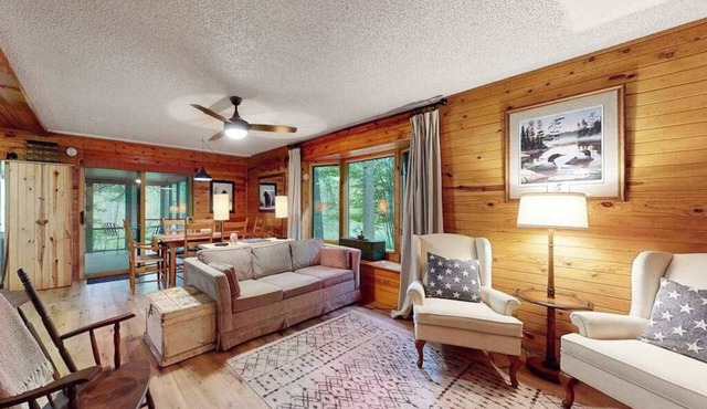 Lakefront cabin with kayaks, firepit, dock & spacious interior