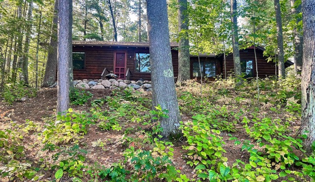 Lakefront escape on Rest Lake with dock, firepit & bike trail access