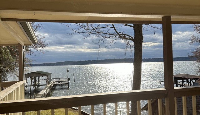 Peaceful lake front home with wrap around porch and relaxing views!