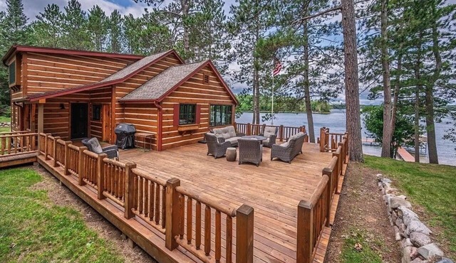 Rare & Private Lake retreat features two separate homes, sandy beach