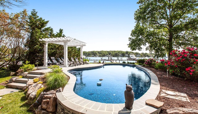 Renovated dog-friendly bayfront home with private hot tub & pool, grill, & dock