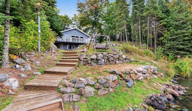 Spacious lakefront home with pier views, canoe, and fire pit - family-friendly