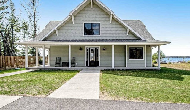 Two dog-friendly lakefront homes with docks, kayaks, rowboat, firepits & beach