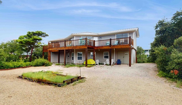Upstairs duplex near the beach with deck, outdoor shower, W/D, streaming, & AC