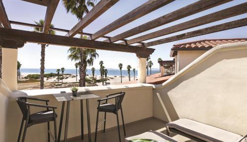 Queen Suite with Two Queen Beds and Partial Ocean View