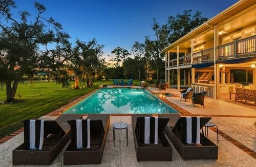 Shoreline Park House | Modern Bayou Home | Pool and Tennis Court